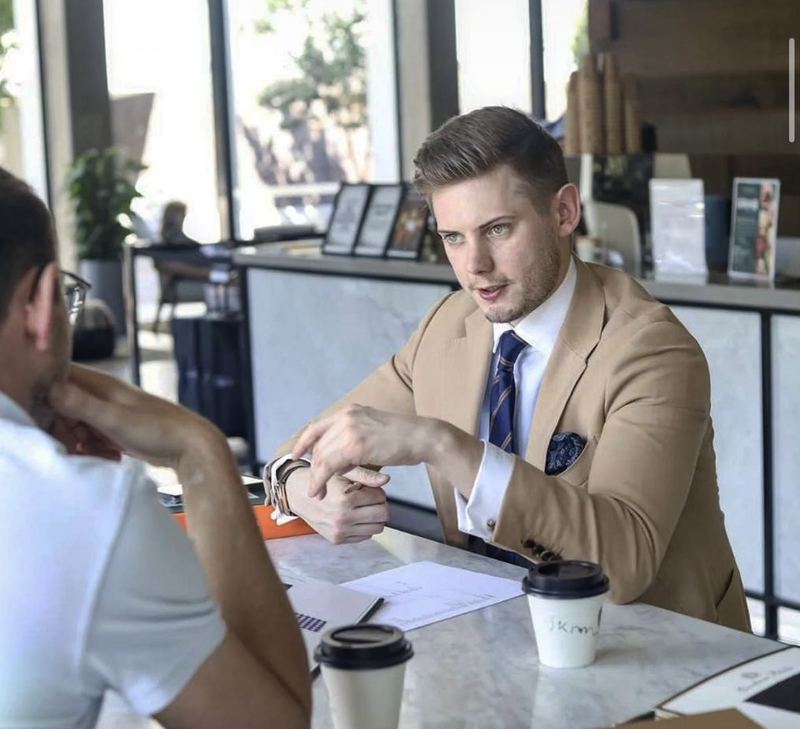 A Norfords consultation, with the tailor talking a client through his options